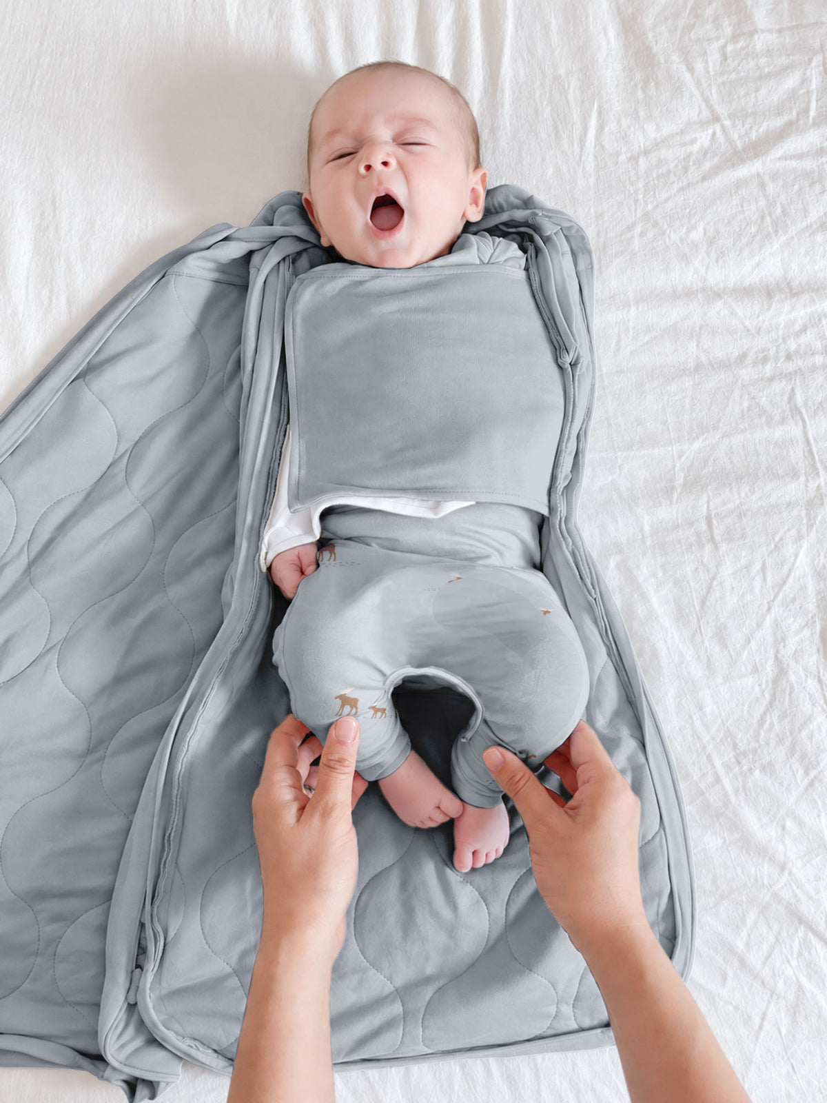 2.5 TOG swaddle sleep sack, light gray moose print, unzipped for baby