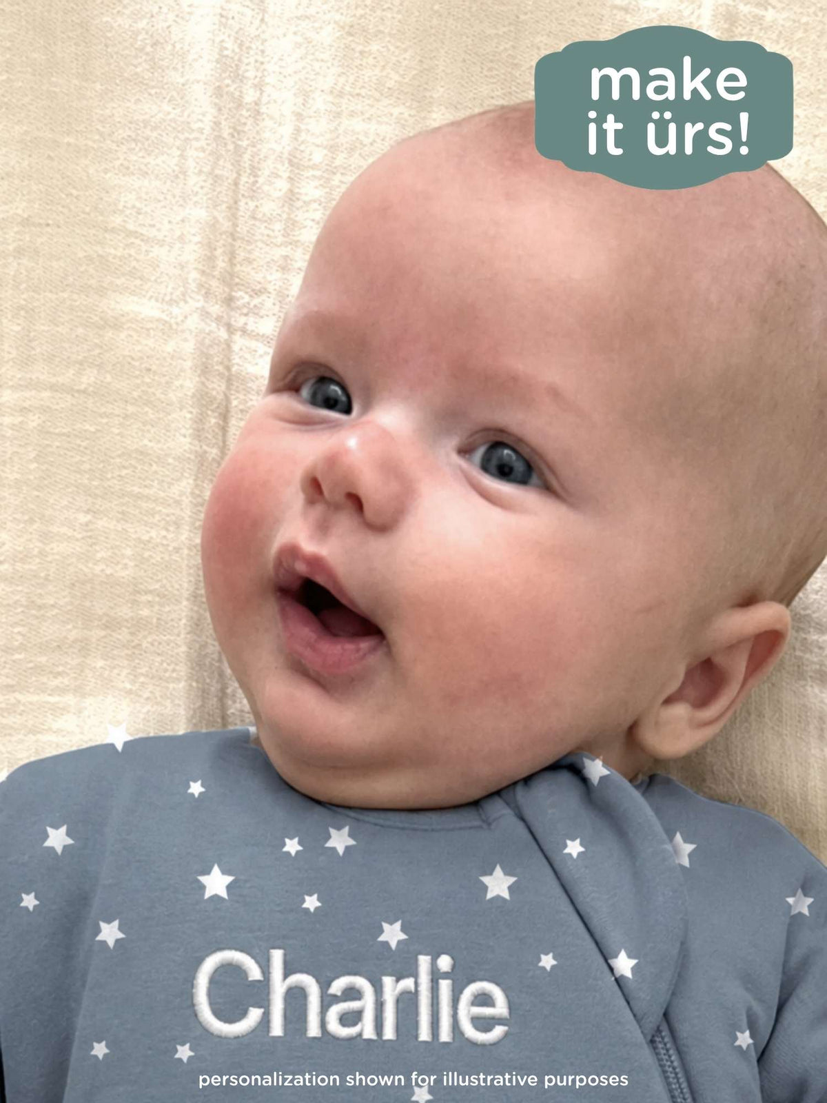 Blue star-print long-sleeve swaddle sack with white stars; personalized name 'Charlie'.