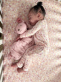 Floral long-sleeve convertible pajamas in sorbet pink, held close with plush face