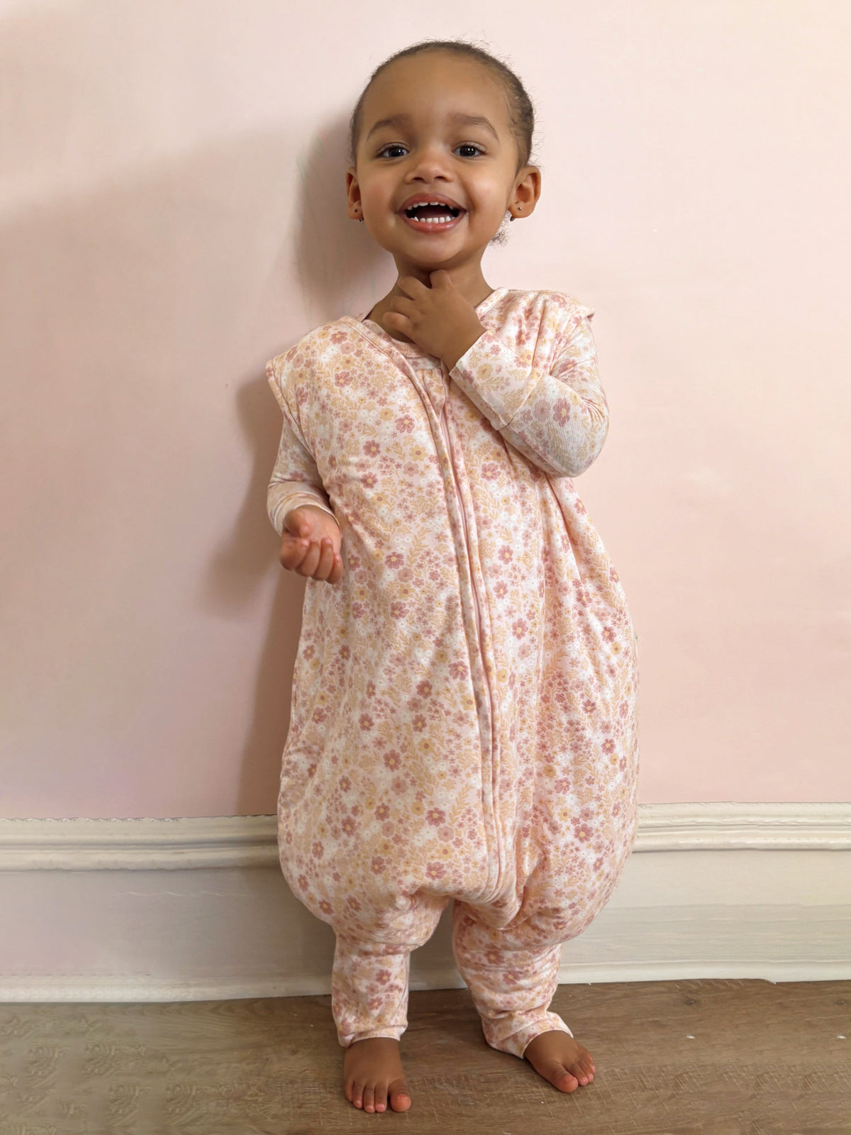 Light pink floral footie sleep sack with front zipper and enclosed footies