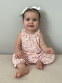 Floral sleeveless bubble romper with ruffled collar, peach-pink toddler outfit