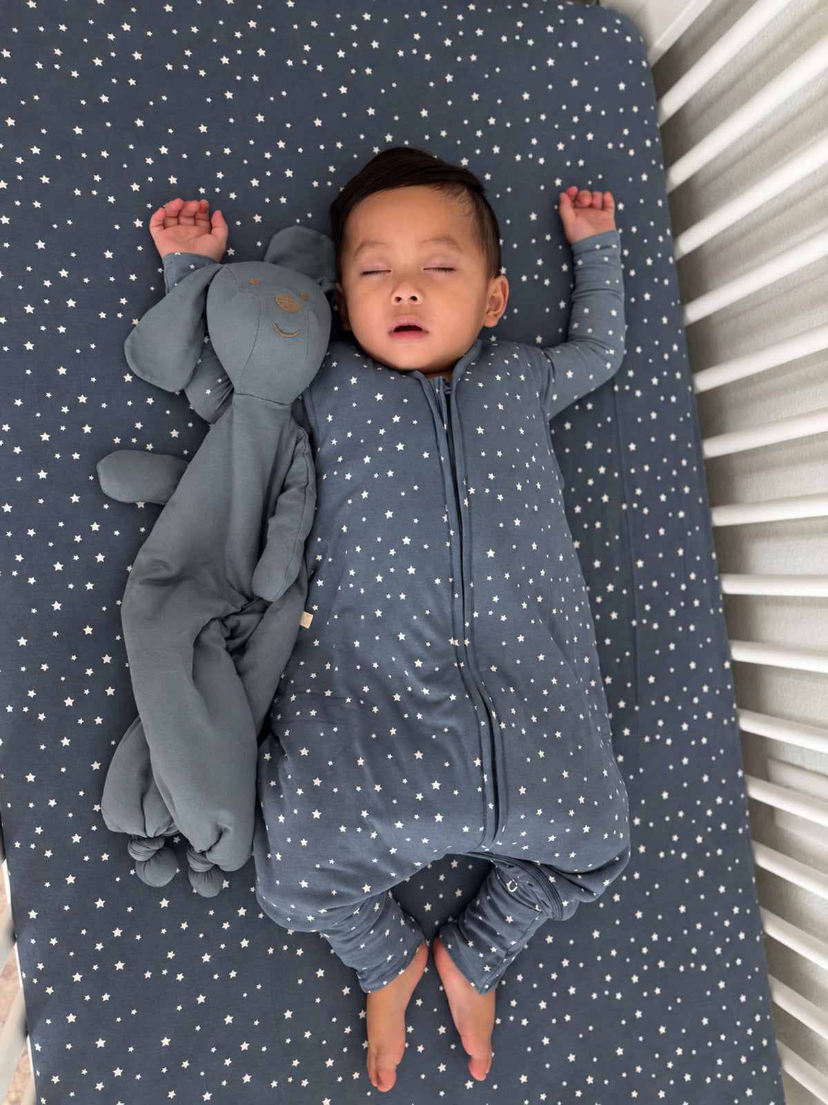 2.5 TOG footie sleep sack in dark blue with star print, full-zip front