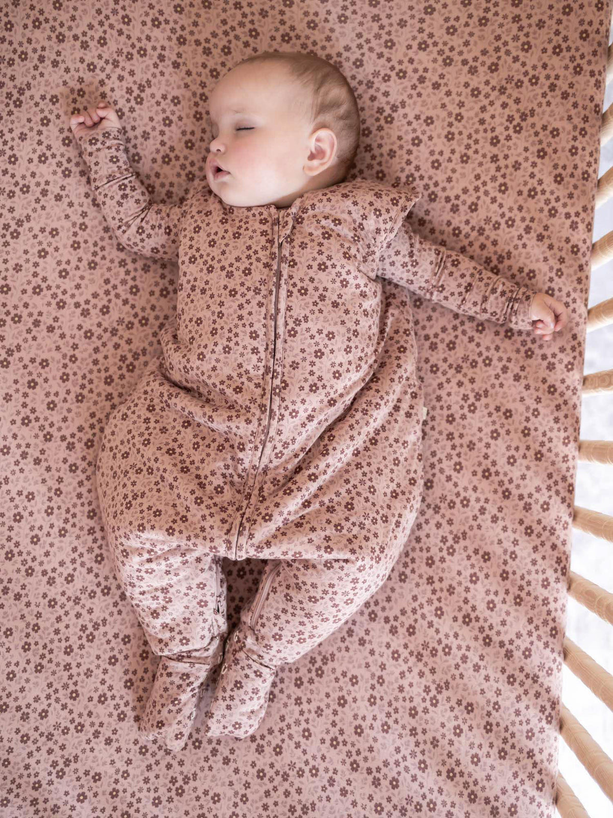 Blush pink floral footed sleep sack with long sleeves, full-length zipper, TOG 1.0.