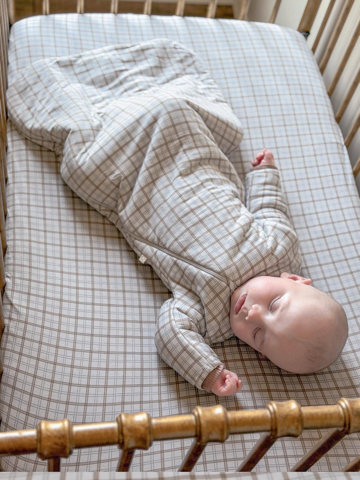 Plaid long-sleeve swaddle sack, baby wrapped in light grid pattern