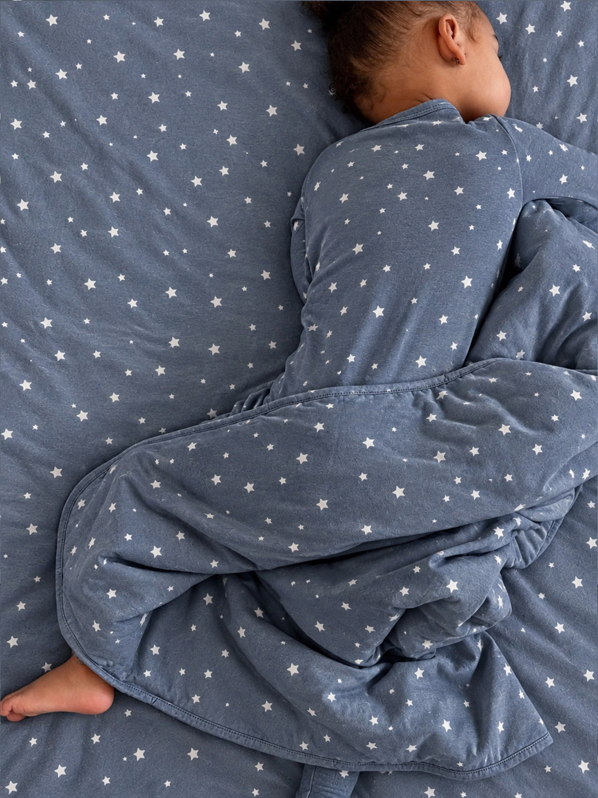 2.5 TOG cloud blanket in blue with white star pattern, folded and layered