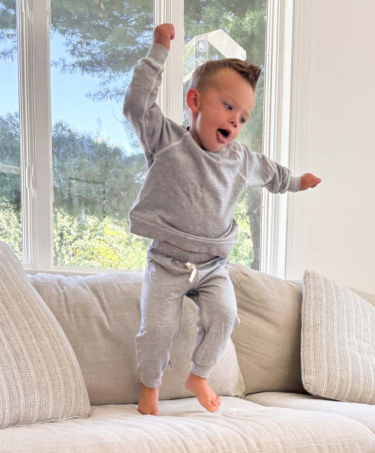 Heather grey fleece toddler sweatsuit with crew neck sweatshirt and jogger pants
