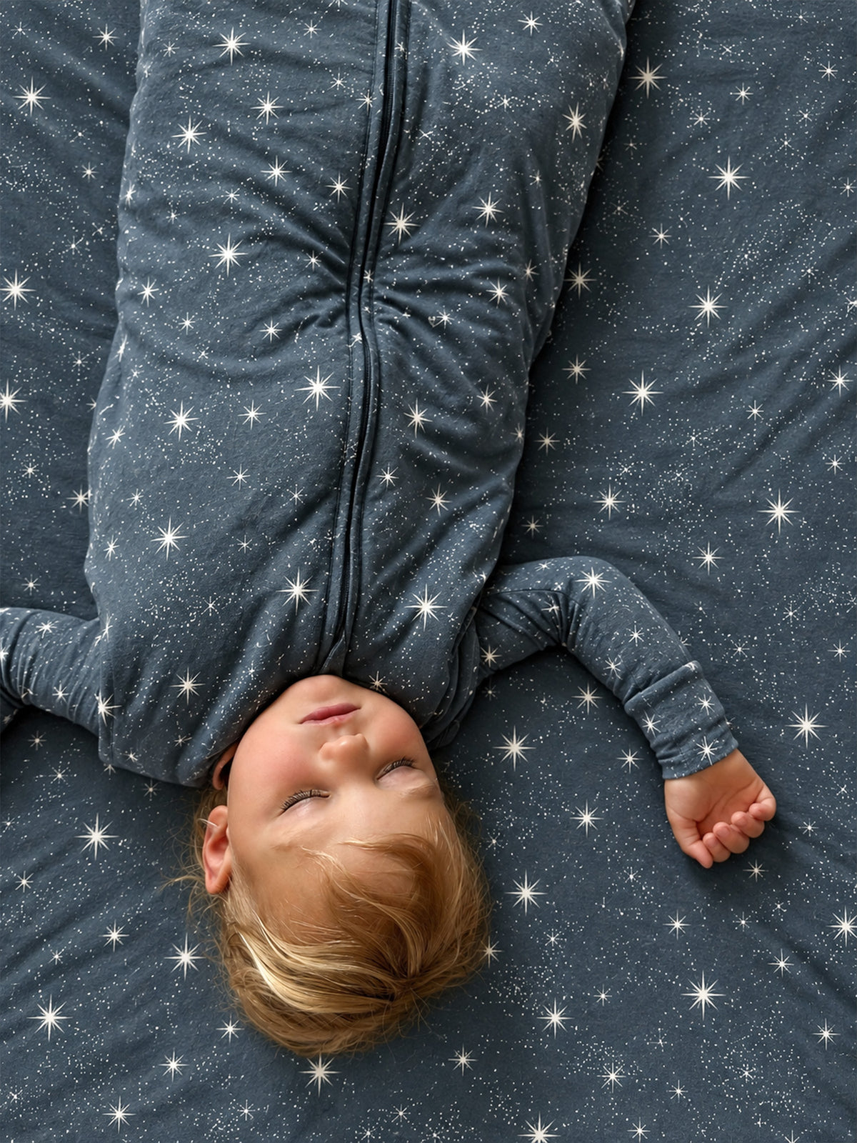 Dark blue star-print footie sleep sack with zip front and long sleeves