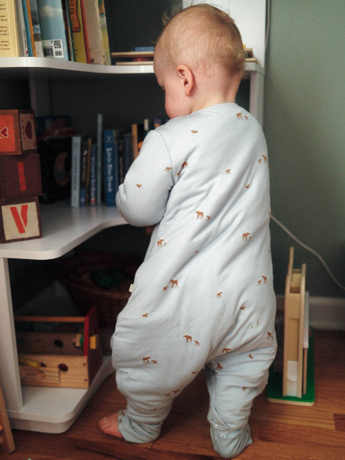 Light gray moose-print footed sleep sack with long sleeves, rear view zipper