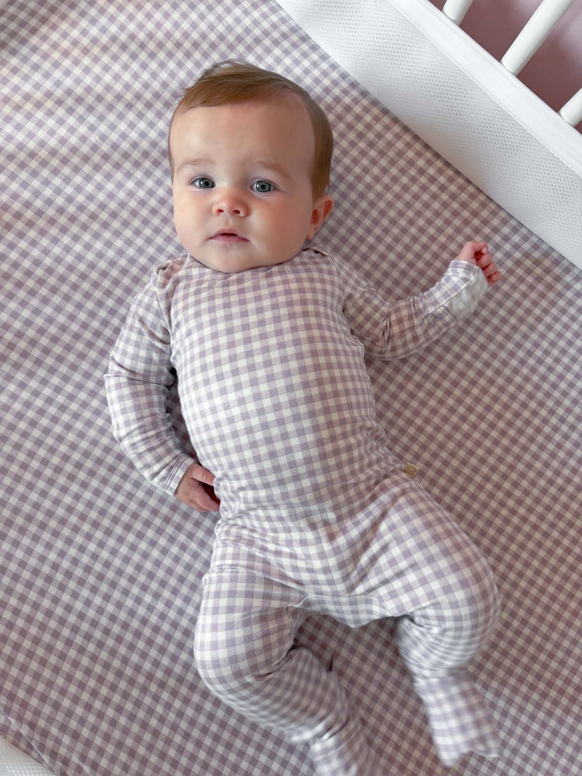 Gingham plaid baby pajama one-piece with long sleeves and footed legs