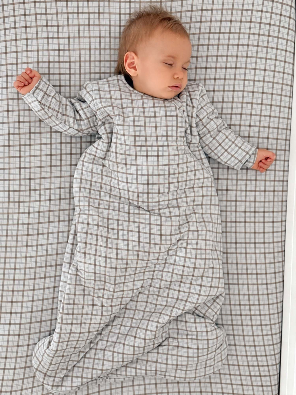 Cream plaid crib sheet with tan/brown check grid, fitted design