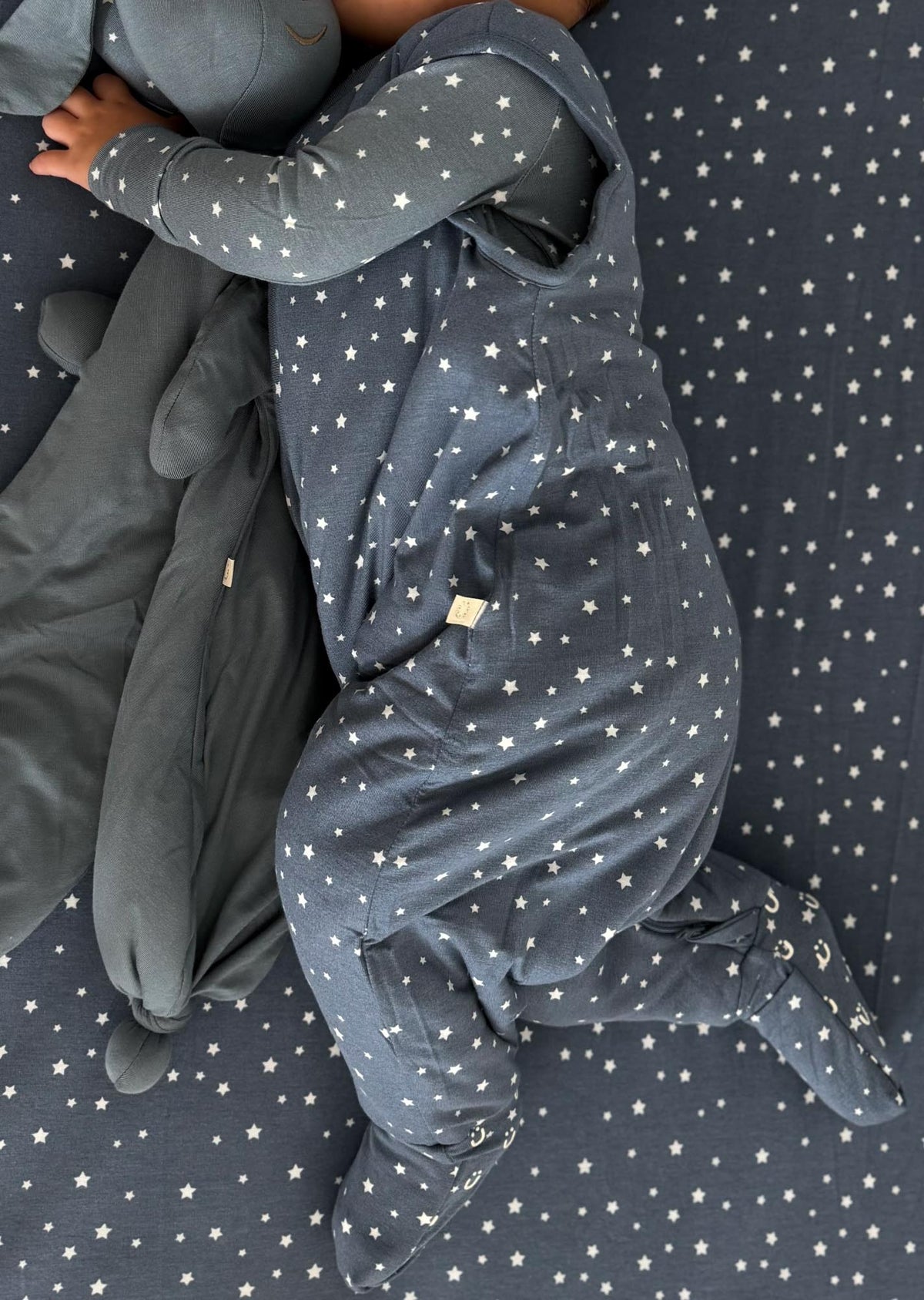Dark blue star-pattern footie sleep sack with full-zip front and long sleeves