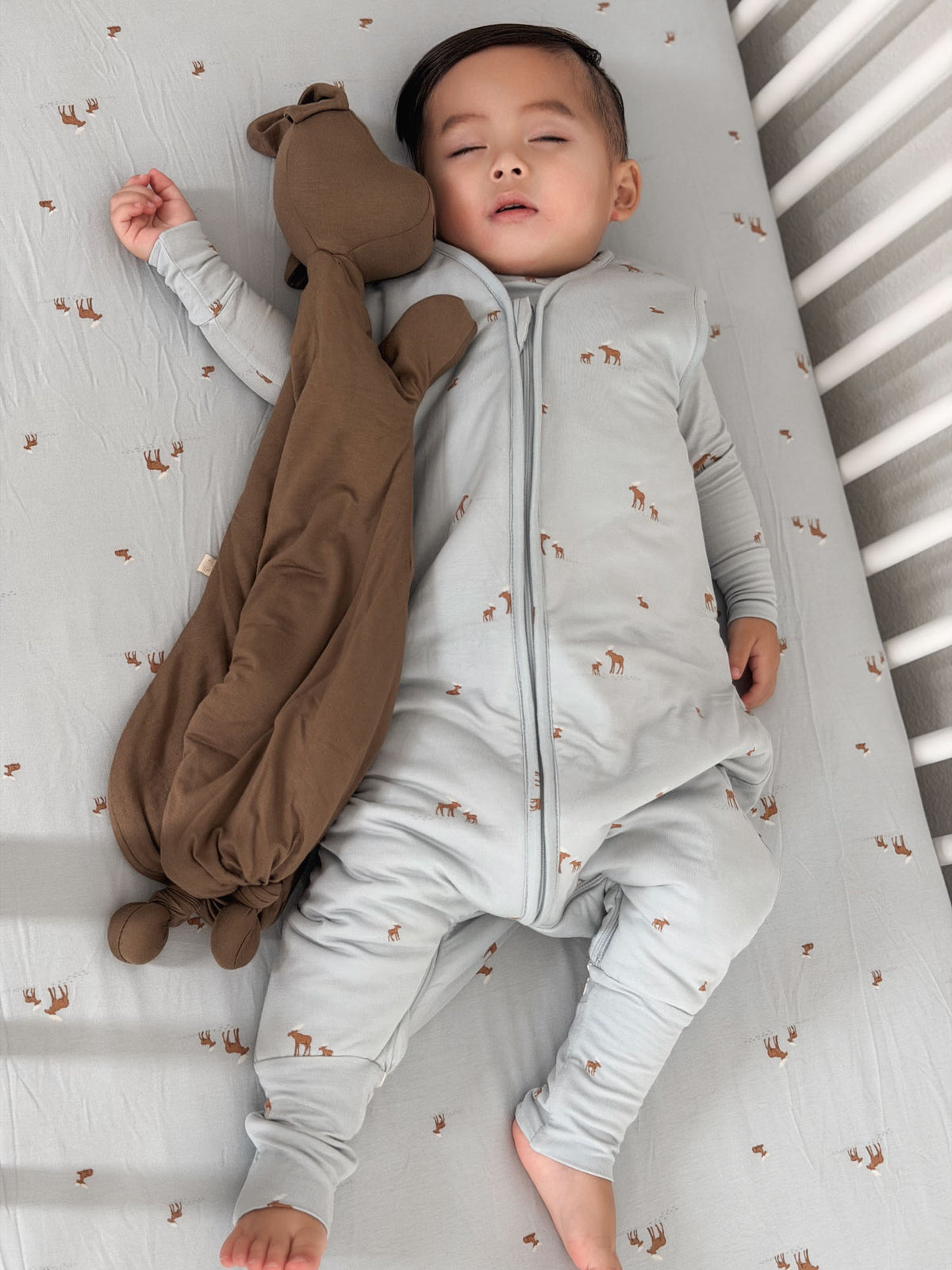 Moose-print footie sleep sack in light gray with zip-up front and hand-to-toe coverage