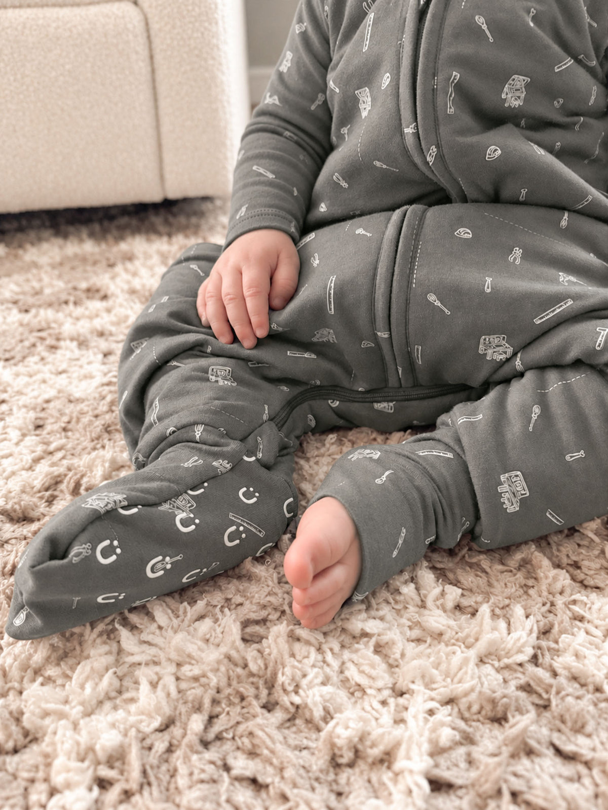 Gray footie sleep sack with tools print, foot openings and long sleeves