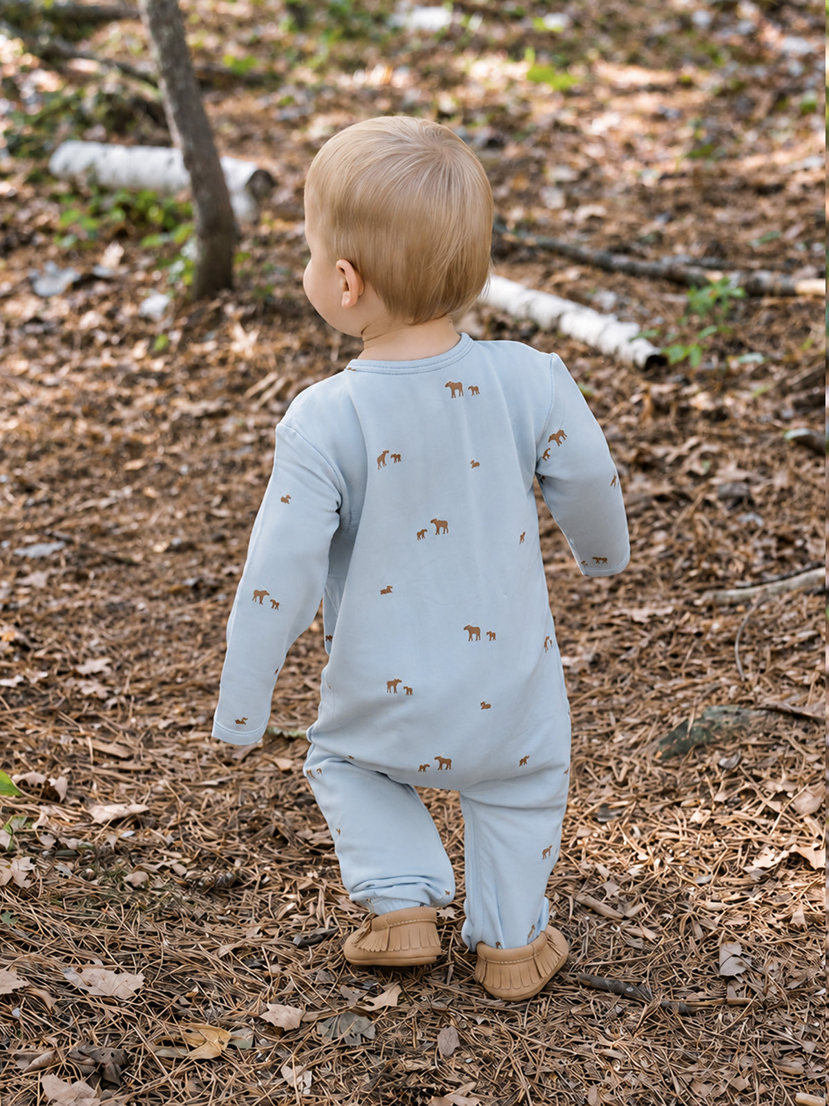 Light blue baby henley jumpsuit with long sleeves and allover moose print, back view