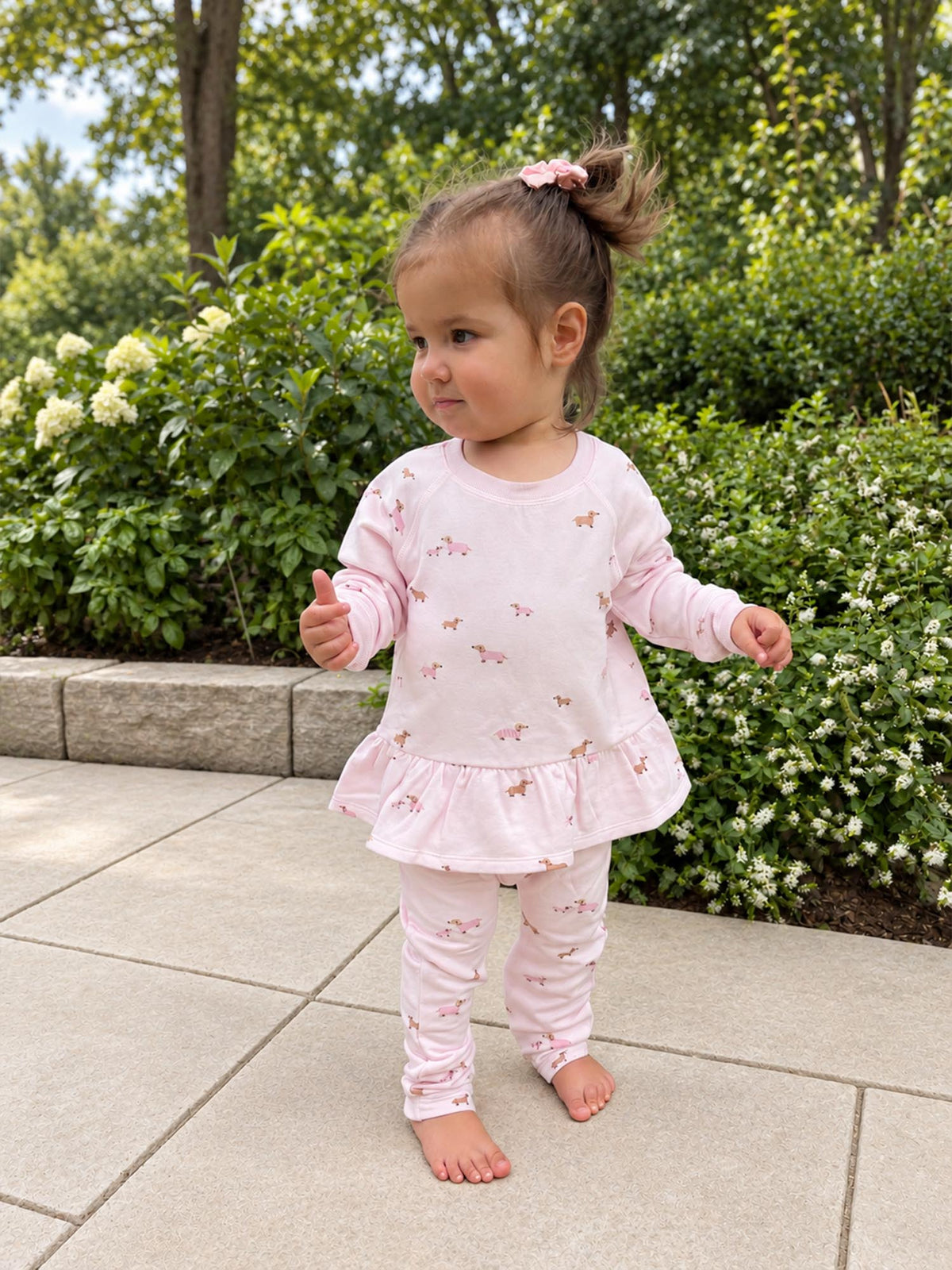 Girls' fleece ruffle sweatsuit set in pale pink with allover dog print, full body