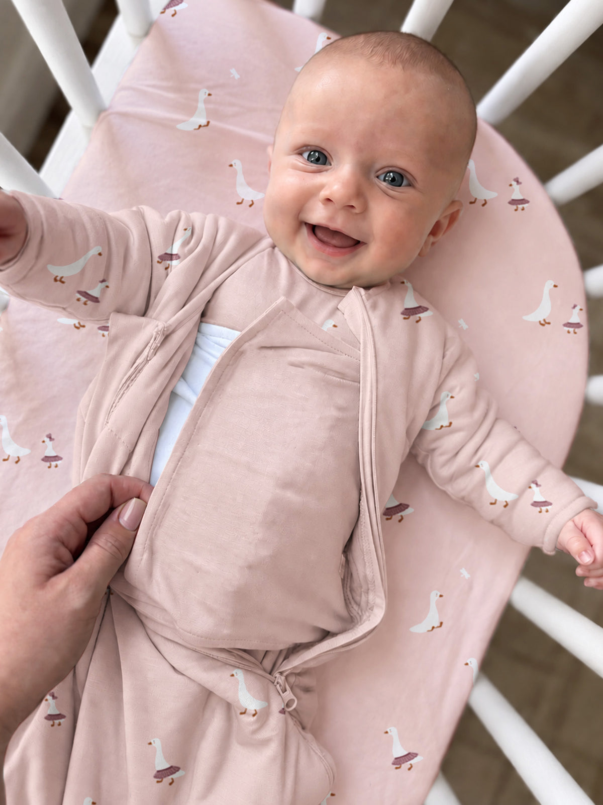 Pink long-sleeve sleep sack with duck print, zip-front and wrap swaddle style