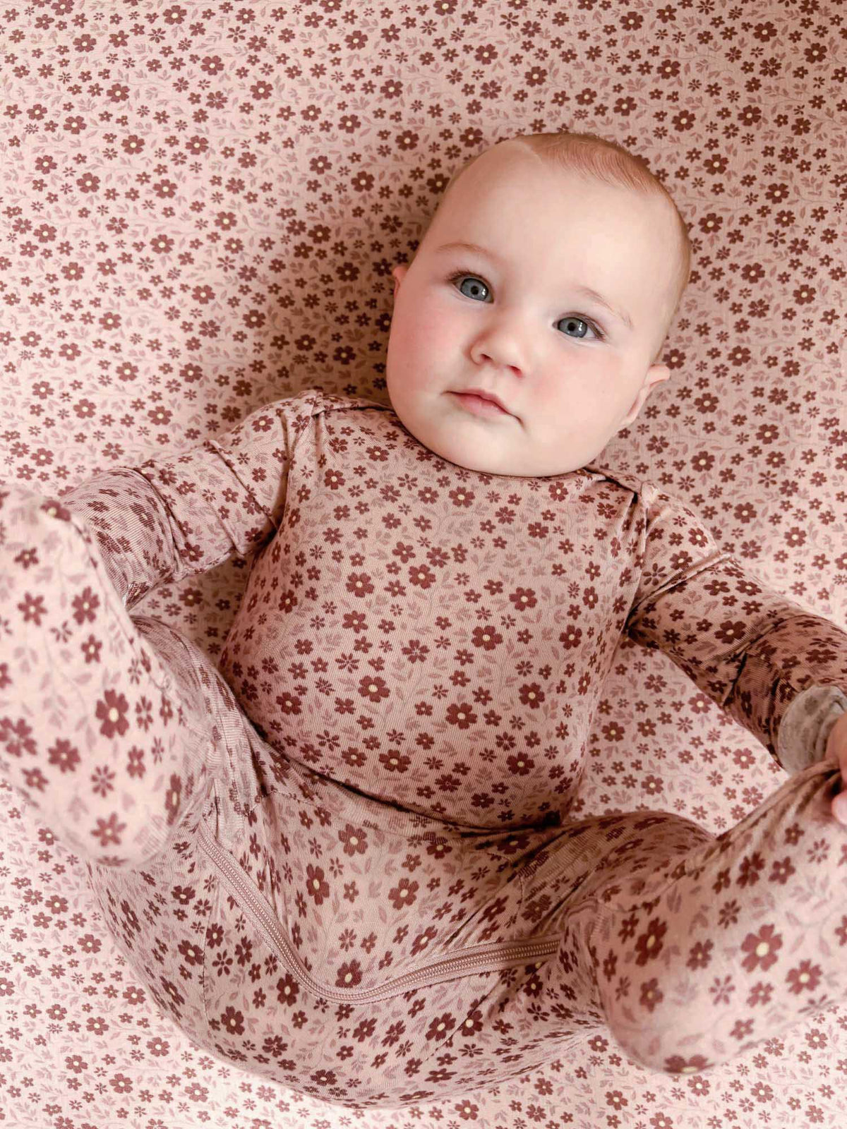Convertible pajama romper with all-over small floral print, long sleeves and zip detail