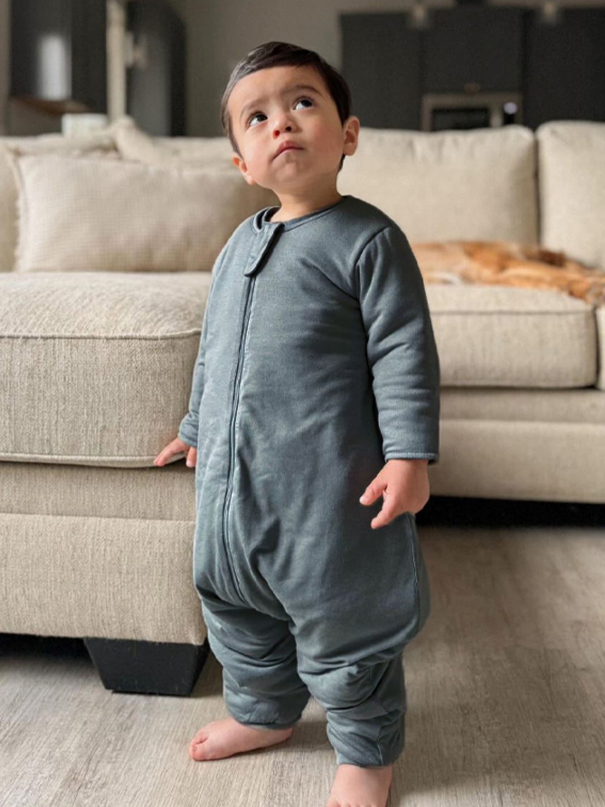 Gray long-sleeve footie sleep sack with zipper, full-body view.