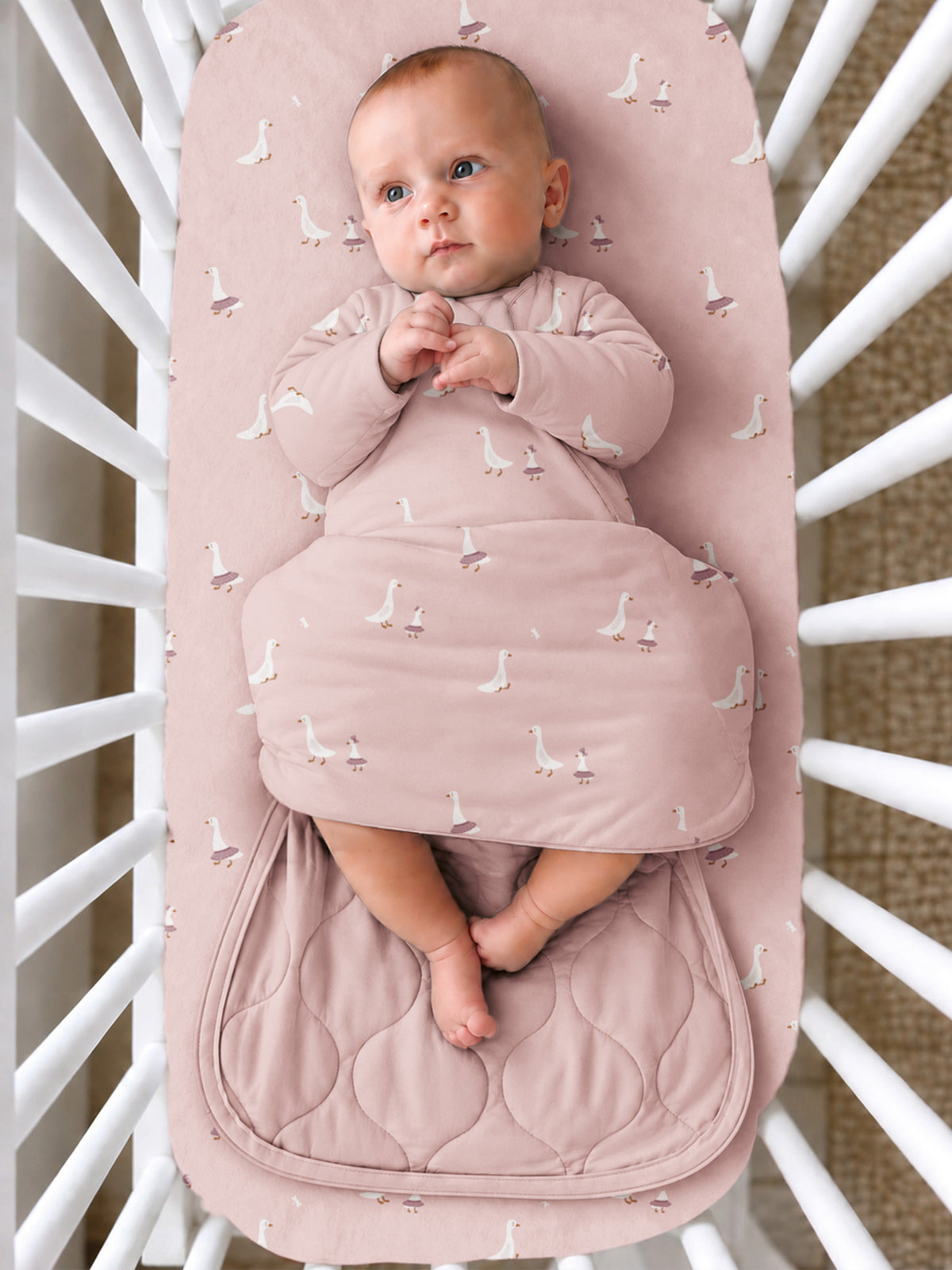 Pink duck-print long-sleeve swaddle sleep sack with zip-front and padded foot area