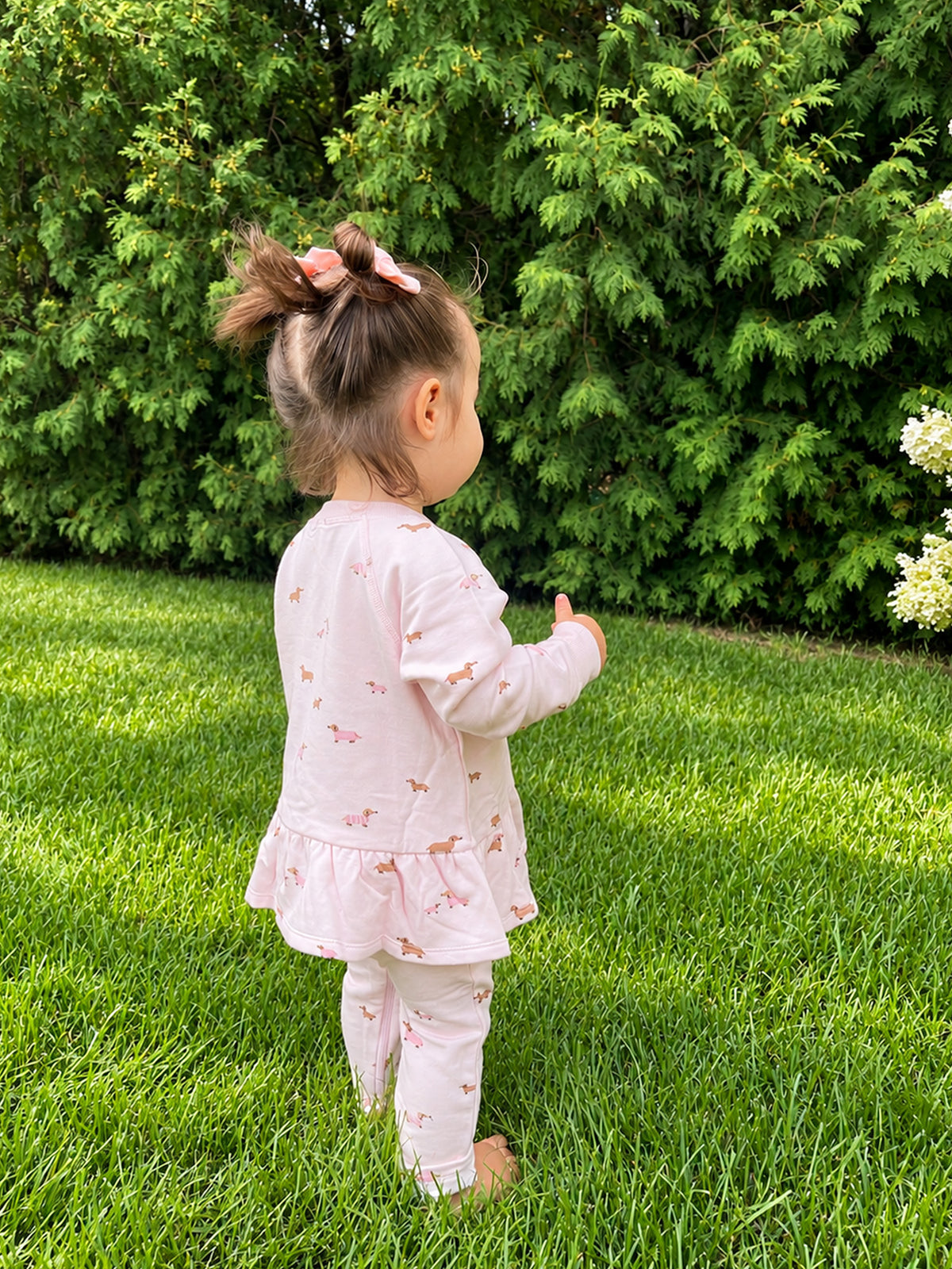 Girls' fleece ruffle sweatsuit set in pale pink dog print, back view